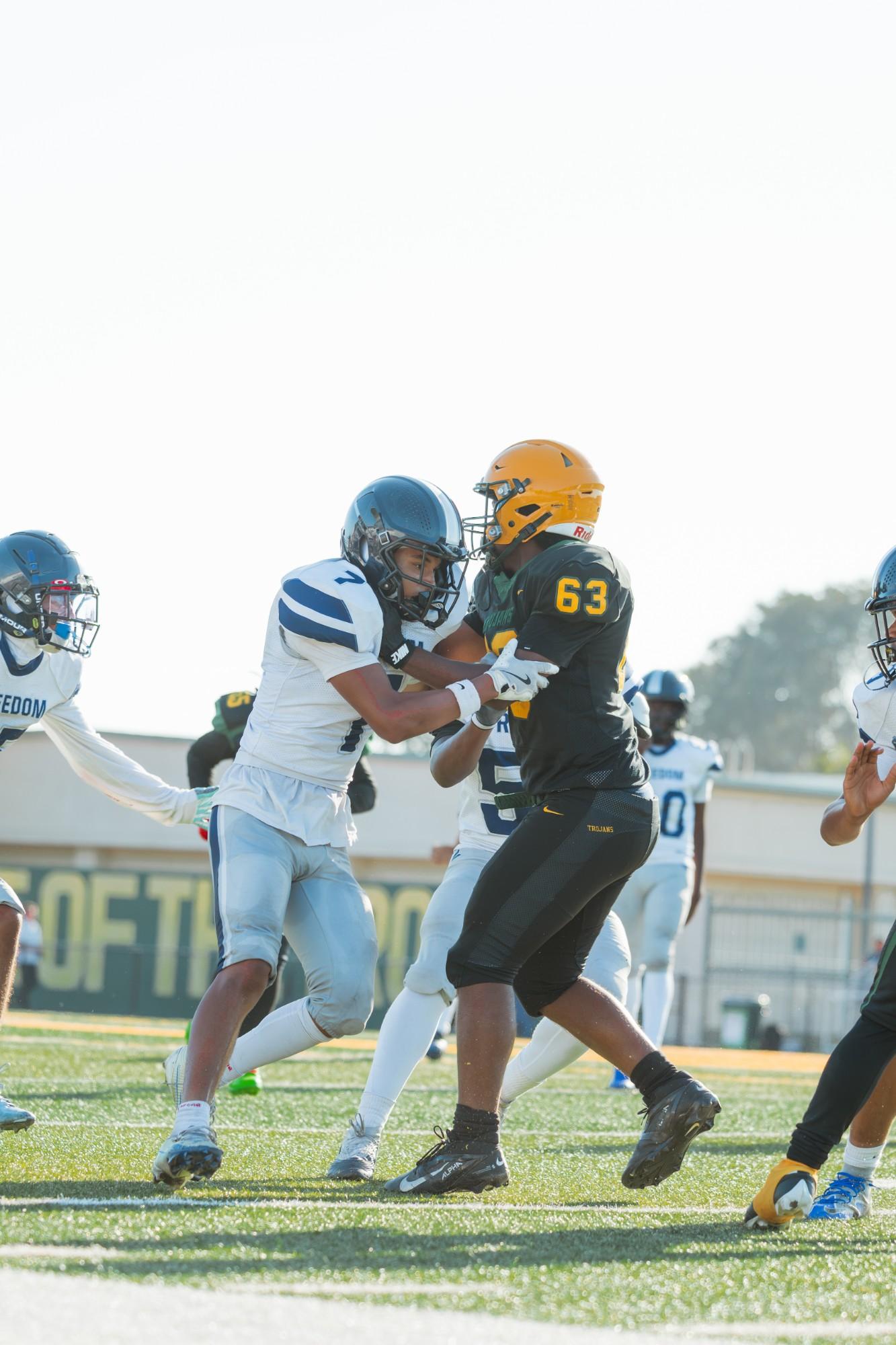 Freedom #7 and Castro Valley #63 lock up at the line of scrimmage