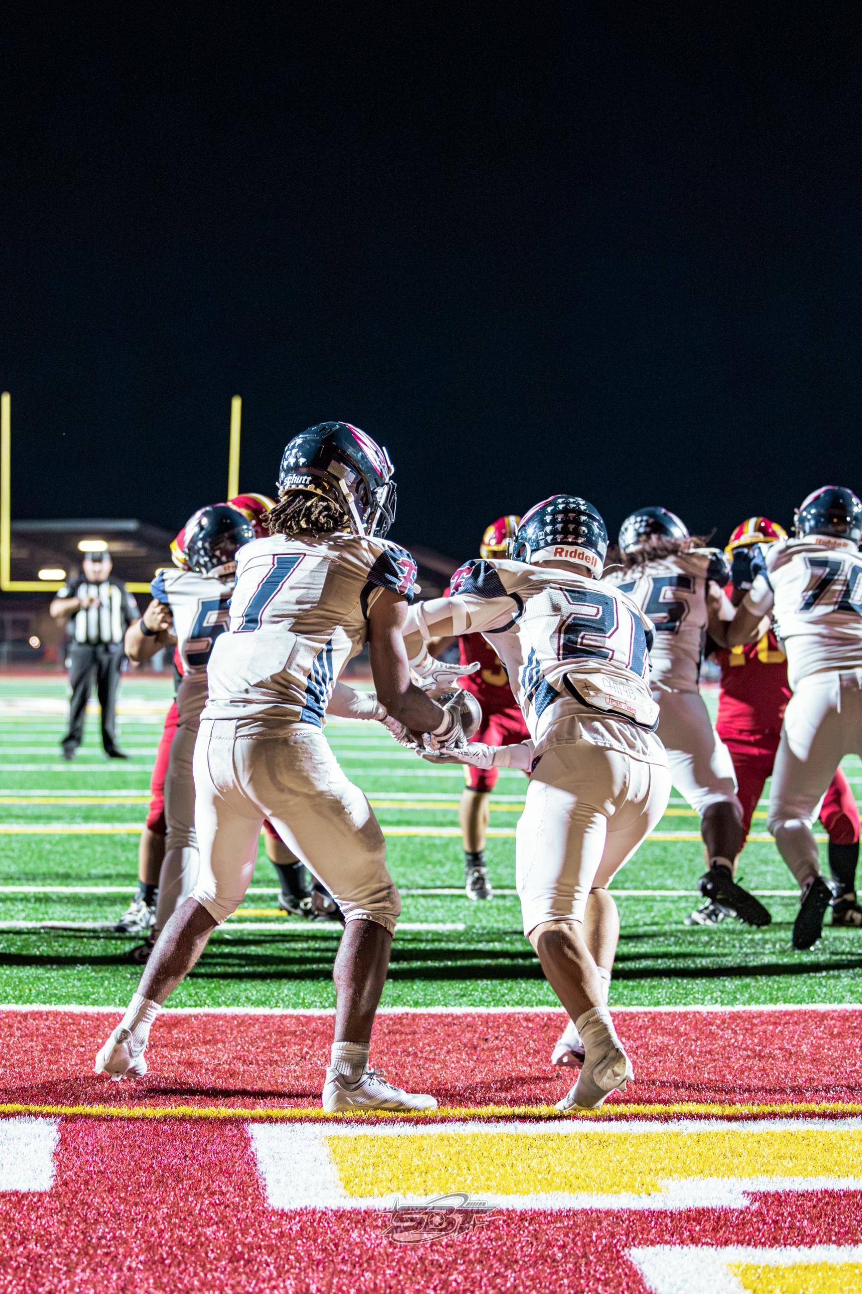 Freedom players celebrate near the end zone