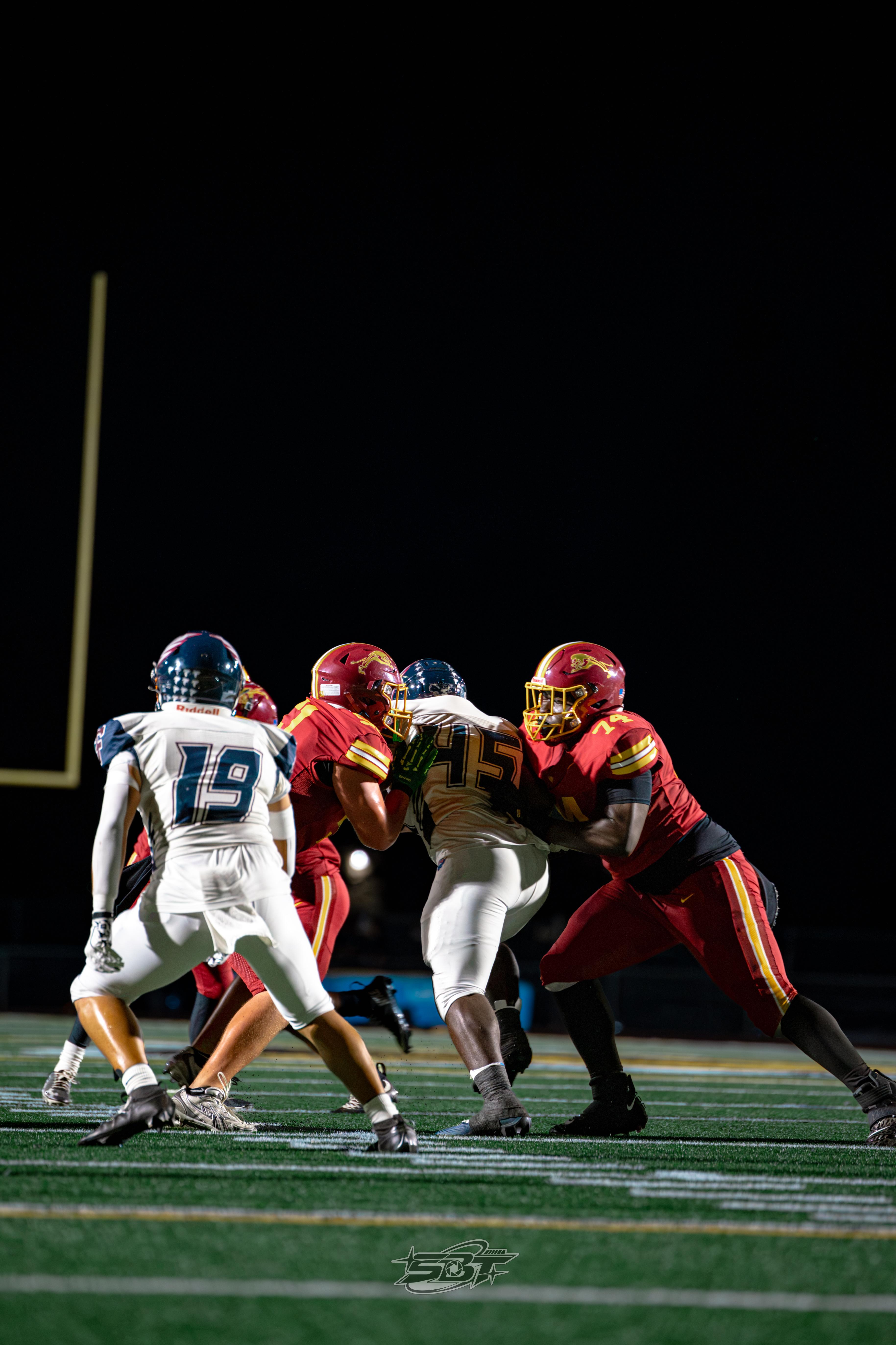 Freedom defender leaping to contest a pass against Liberty