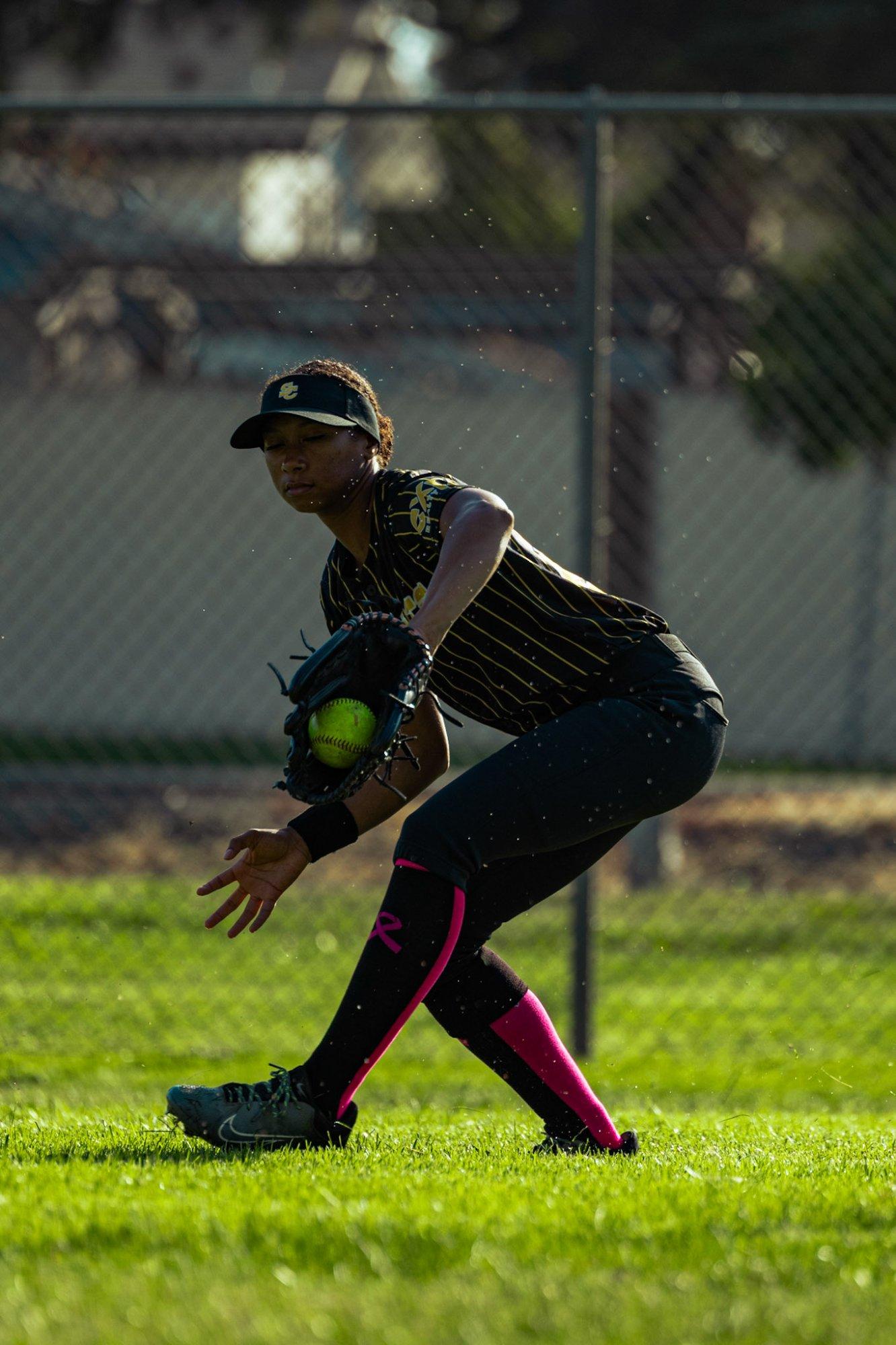 Wildcats infielder fielding a ground ball